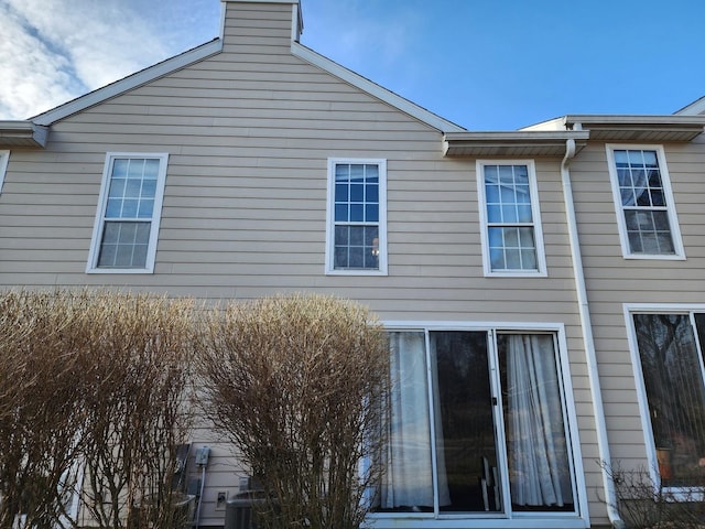 view of side of home featuring a chimney