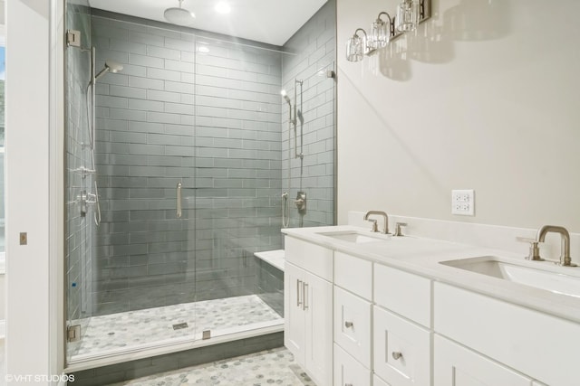 bathroom with vanity and a shower with door