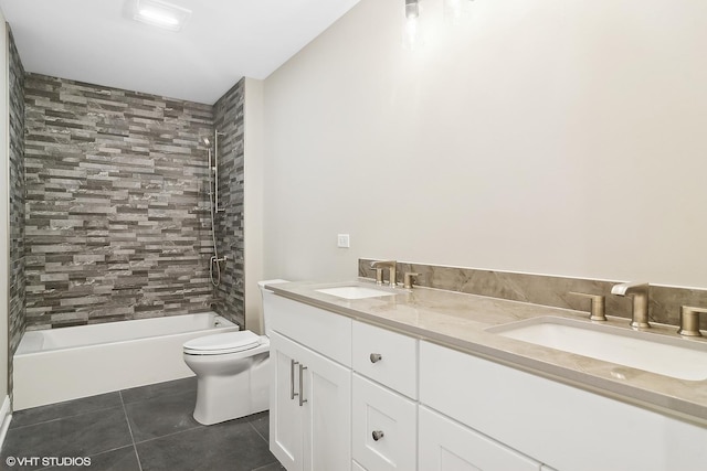 full bathroom with vanity, toilet, tiled shower / bath combo, and tile patterned flooring