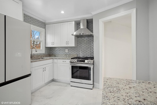 kitchen featuring white cabinetry, wall chimney exhaust hood, sink, and gas stove