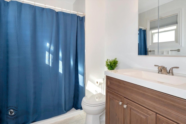 bathroom with tile patterned flooring, a shower with curtain, vanity, and toilet