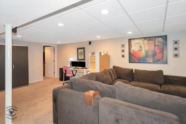 living area with baseboards, a drop ceiling, recessed lighting, and light colored carpet