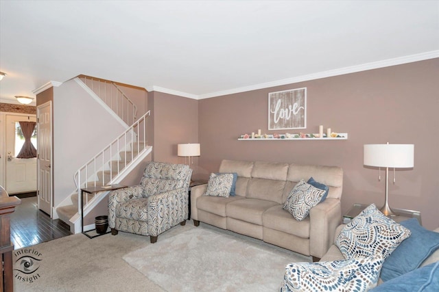 living area featuring stairway, wood finished floors, crown molding, and carpet flooring