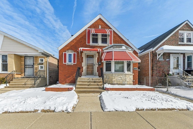 view of front of home featuring brick siding and stone siding