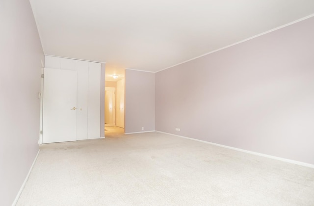 unfurnished bedroom featuring light colored carpet