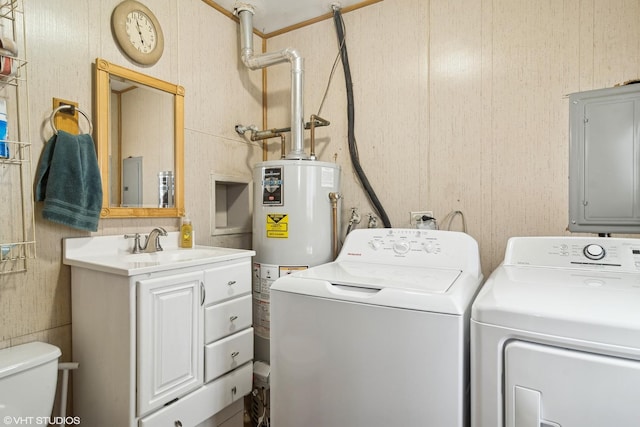 washroom featuring sink, electric panel, water heater, and washing machine and dryer