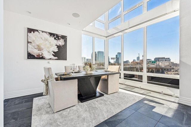 office area featuring a city view and baseboards