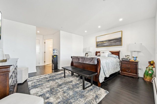 bedroom with recessed lighting, a baseboard heating unit, baseboards, and dark wood-style flooring