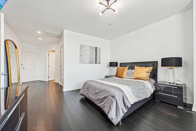 bedroom with visible vents, baseboards, and dark wood-style flooring