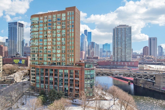 property's view of city featuring a water view