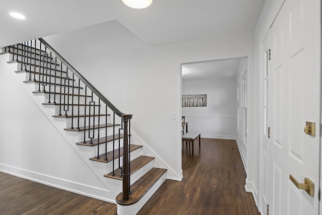 stairway featuring hardwood / wood-style flooring