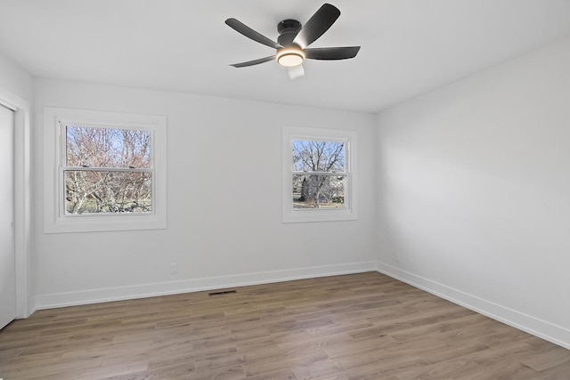 unfurnished room with ceiling fan and light hardwood / wood-style floors