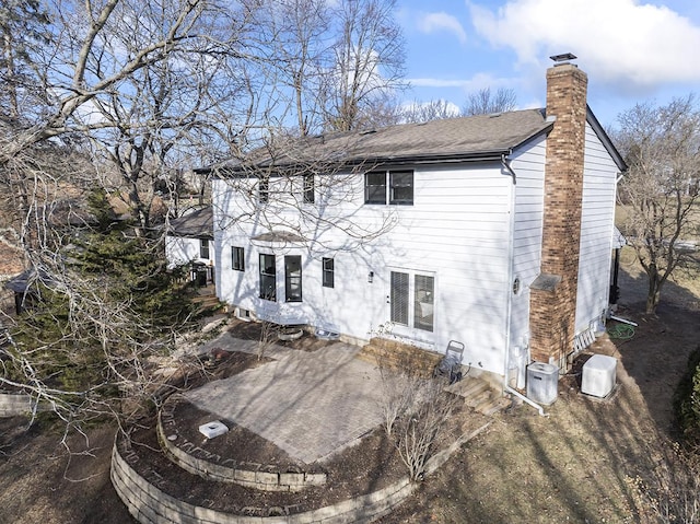 back of property featuring a patio area