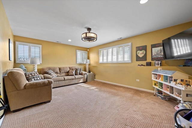 carpeted living room with visible vents, recessed lighting, and baseboards