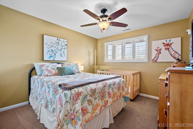 carpeted bedroom with visible vents, ceiling fan, and baseboards