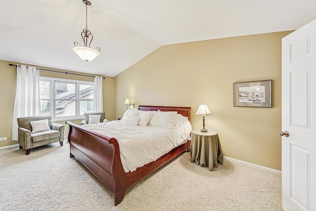 carpeted bedroom featuring vaulted ceiling