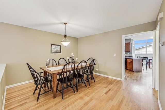 dining room featuring light wood-type flooring