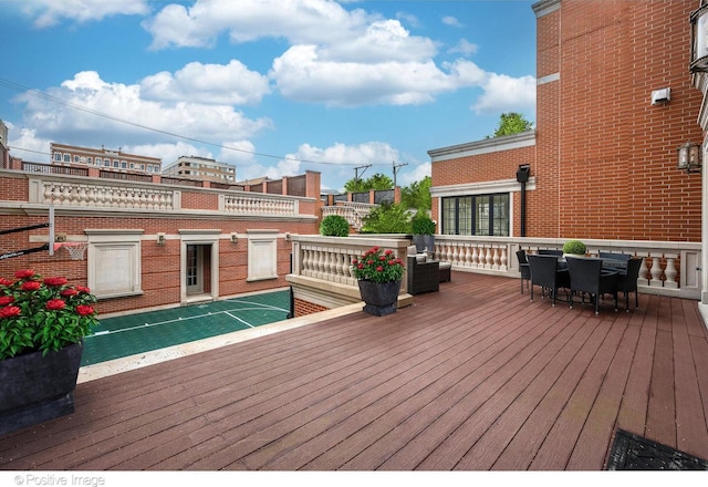 wooden deck featuring shuffleboard