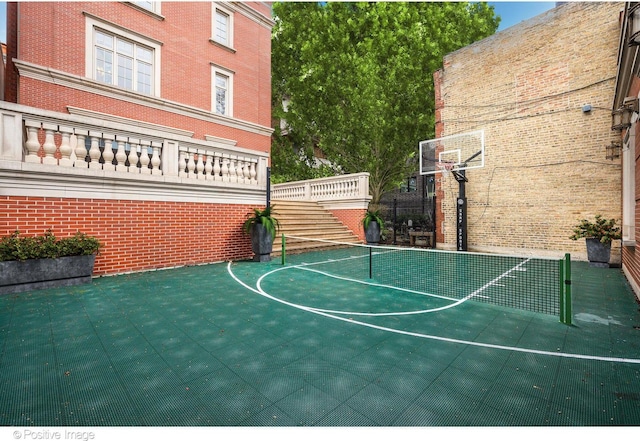 view of basketball court with basketball court and fence