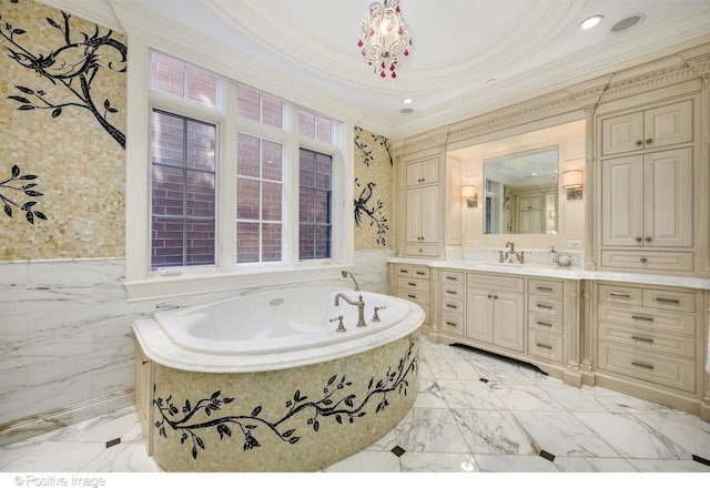 full bath featuring marble finish floor, vanity, recessed lighting, crown molding, and a garden tub