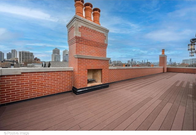 wooden deck featuring a city view
