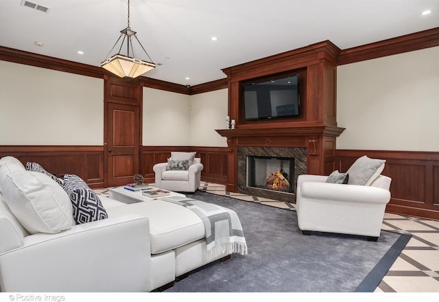 home theater room with recessed lighting, visible vents, wainscoting, and crown molding