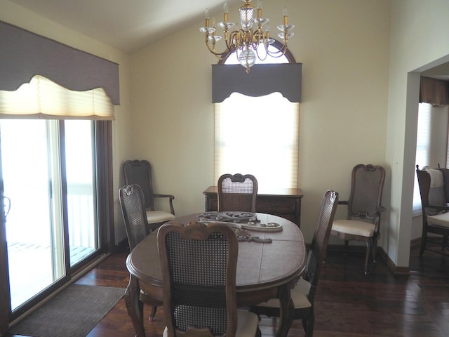 dining room featuring vaulted ceiling, dark wood-style flooring, baseboards, and an inviting chandelier