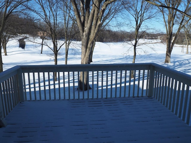 view of snow covered deck