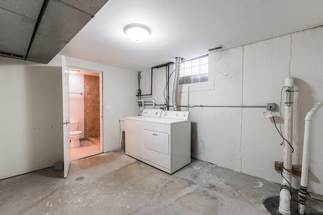 washroom featuring independent washer and dryer