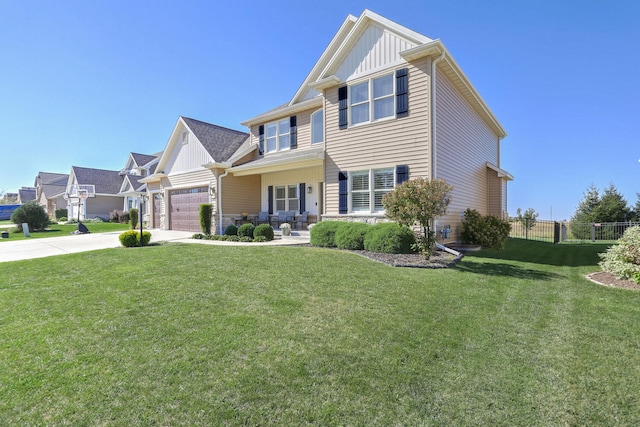 craftsman house featuring a garage, a front yard, and covered porch