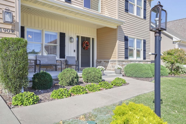 property entrance with covered porch