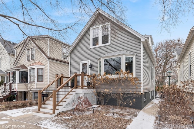 view of front of house with stairs