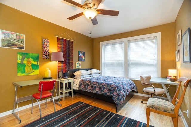 bedroom featuring hardwood / wood-style floors and ceiling fan