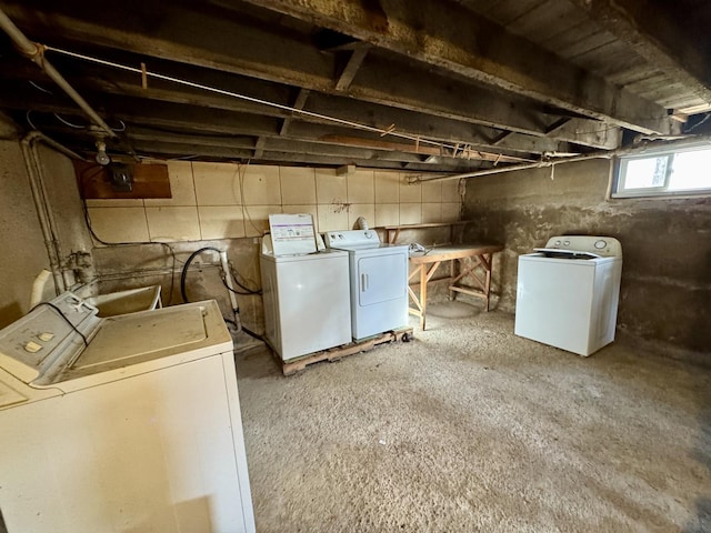 clothes washing area featuring laundry area and separate washer and dryer