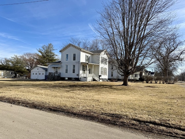 view of front of house featuring a garage and a front yard