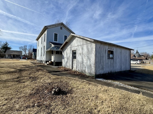 view of property exterior with entry steps