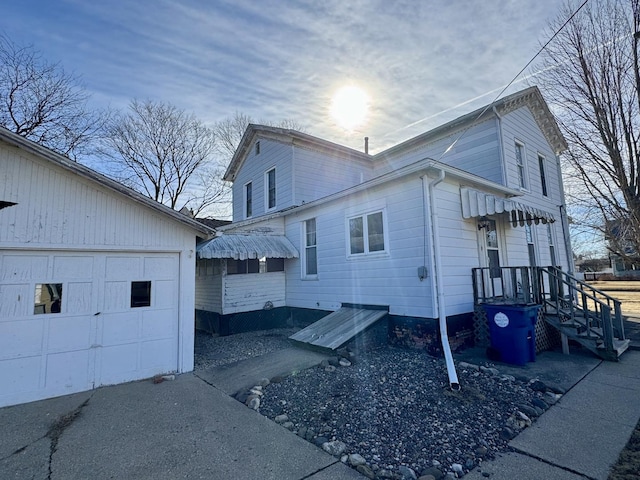 view of side of home featuring a garage