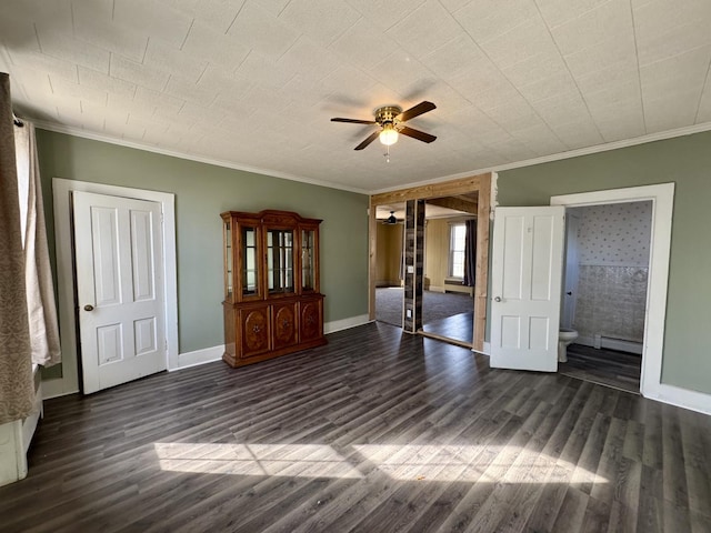 interior space featuring dark wood-style floors, baseboard heating, and crown molding