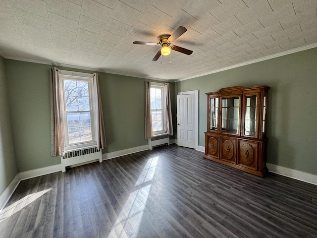 interior space featuring a wealth of natural light, dark wood finished floors, and radiator heating unit