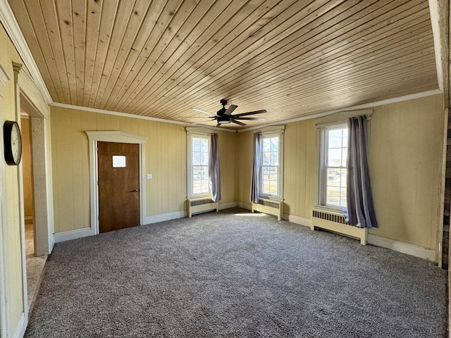 interior space with ornamental molding, wood ceiling, and radiator