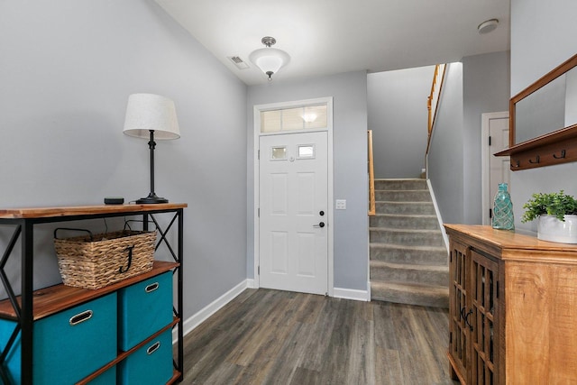 foyer with dark hardwood / wood-style floors