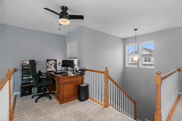 office space with light carpet and an inviting chandelier