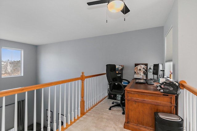 office space featuring light colored carpet and ceiling fan