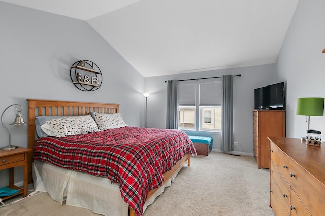 carpeted bedroom featuring vaulted ceiling