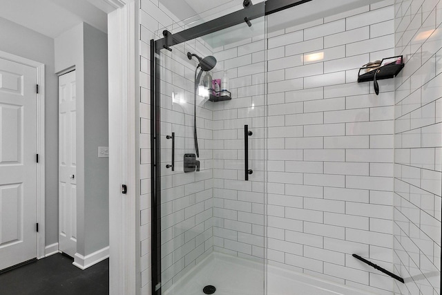 bathroom with a shower with shower door