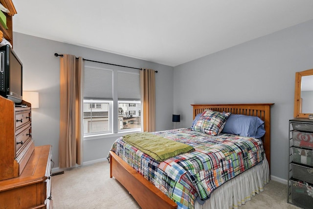 bedroom with light carpet