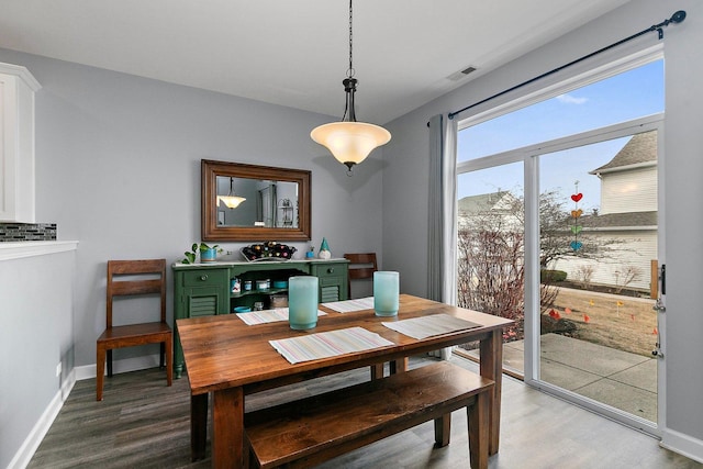 dining area with hardwood / wood-style flooring