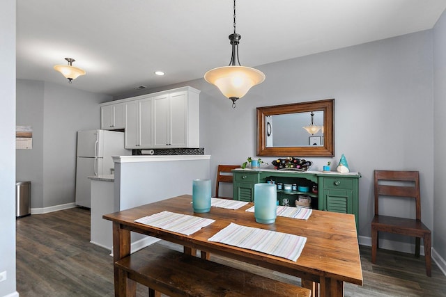 dining room featuring dark hardwood / wood-style floors