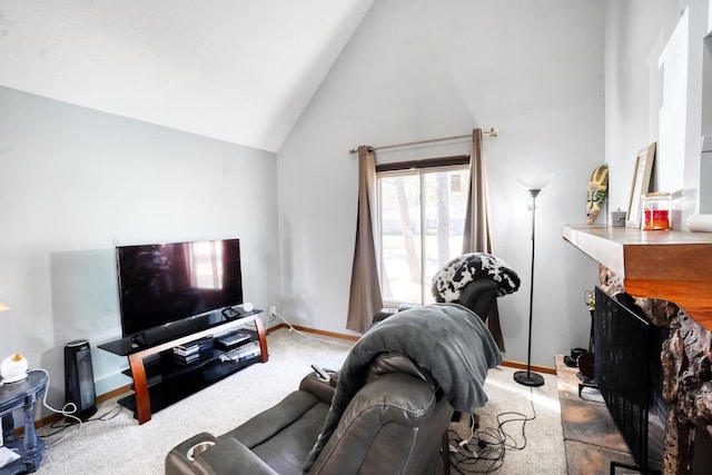 living room with high vaulted ceiling, carpet, a fireplace, and baseboards