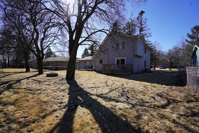 view of home's exterior featuring a deck and a fenced backyard